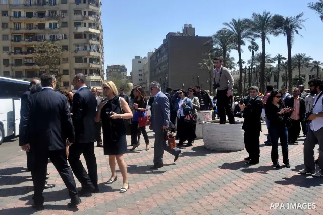 Tourists take memorial photos on March 29,2011 at the downtown Cairo's Tahrir square, the giant traffic-clogged roundabout, which hundreds of thousands of Egyptians turned into the focus of their uprising to bring down H...