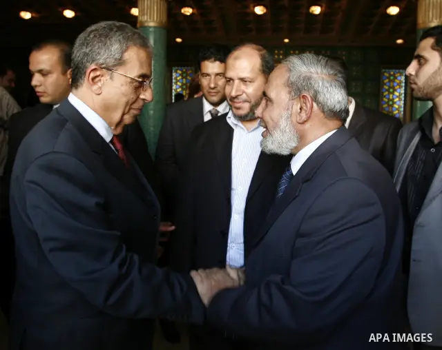 Palestinian Hamas' leader from Gaza, Mahmoud Zahar meets with the Arab League chief Amr Moussa during a press conference at the Arab League headquarters in Cairo, Egypt, Tuesday, March 29, 2011. Photo by Wissam Nassar