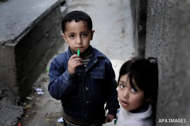Palestinians refugees children are pictured playing in the alley of al Shatea refugee camp in the west of Gaza City on 29 March 2011. Photo by Mustafa Hassona