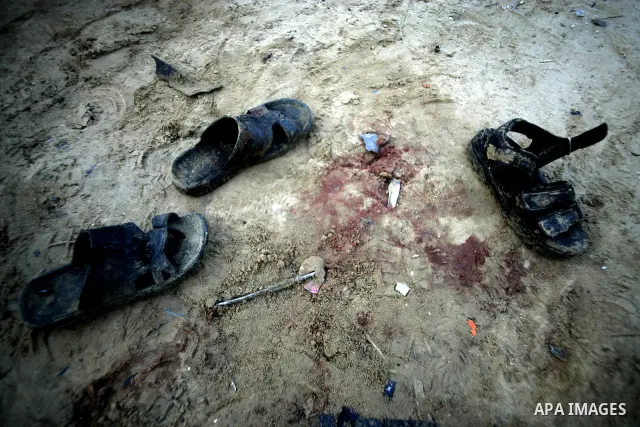 The shoe of Muhammed abu muammer is seen on blood stains in a street that was hit earlier today by an Israeli strike in Rafah,southern Gaza Strip on March 30, 2011.The raid killed Muammar and wounded the other.Photo by A...