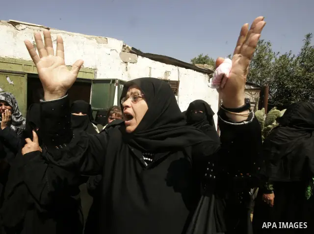 Palestinian women mourn during the funeral of Mohammed Muammar, who was killed during an Israeli air strike the previous day, in Khan Yunis, southern Gaza Strip, on March 30, 2011. The raid killed Muammar and wounded the...