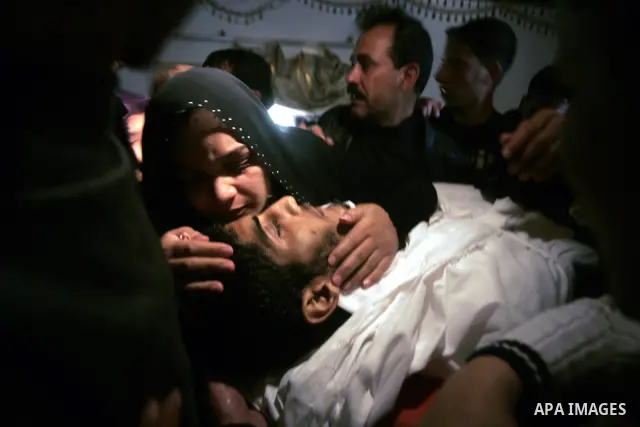 Palestinian women mourn during the funeral of Mohammed Muammar, who was killed during an Israeli air strike the previous day, in Khan Yunis, southern Gaza Strip, on March 30, 2011. The raid killed Muammar and wounded the...