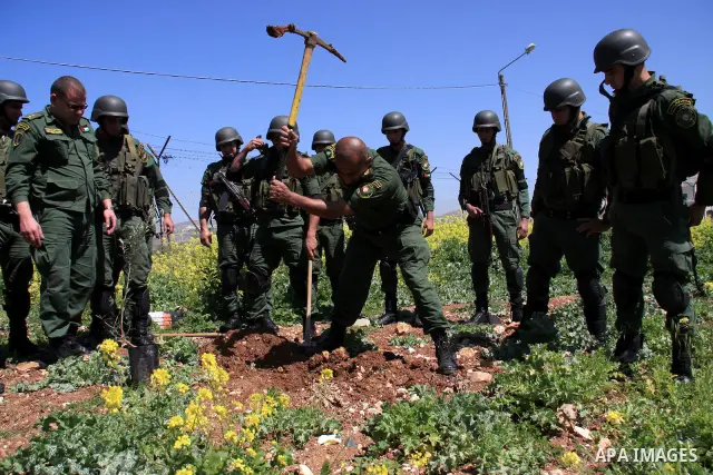 Palestinian security officers plant trees during an event marking Land Day, near the West Bank city of Nablus, Wednesday, March 30, 2011. Land Day commemorates the killing of six Arab citizens of Israel by the Israelis o...