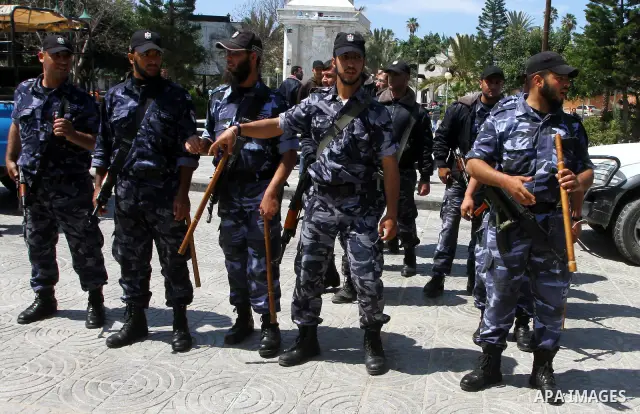 Palestinian Hamas security patrol in a street as Palestinian demonstrators take part in a protest calling for political unity between Gaza's Hamas rulers and the Fatah-dominated Palestinian Authority based in the West Ba...