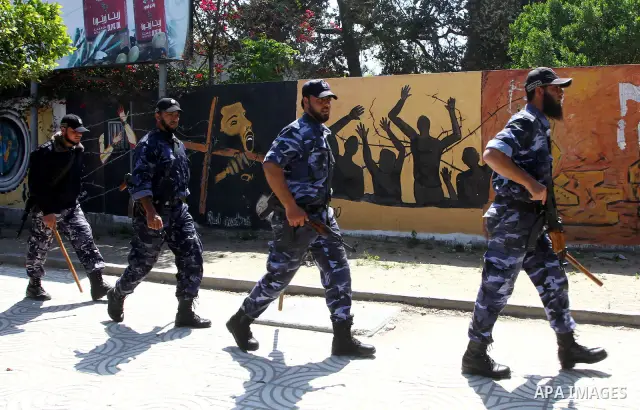 Palestinian Hamas security patrol in a street as Palestinian demonstrators take part in a protest calling for political unity between Gaza's Hamas rulers and the Fatah-dominated Palestinian Authority based in the West Ba...