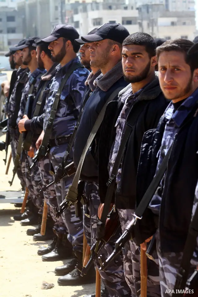 Palestinian Hamas security patrol in a street as Palestinian demonstrators take part in a protest calling for political unity between Gaza's Hamas rulers and the Fatah-dominated Palestinian Authority based in the West Ba...