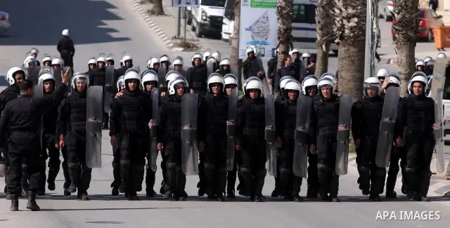 Palestinians anti-riot Police block the road to prevent Palestinian protesters, marking the 35th anniversary of the Land Day, to reach the Israeli checkpoint of Biet El north of Ramallah, 30 March 2011. The rallies kicke...