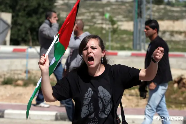 Palestinians take part in a rally marking the Land Day in the West Bank city of Ramallah, March 30, 2011. The Palestinians mark March 30 as the Land Day to remember the deaths of six Arabs in the hands of Israeli forces...