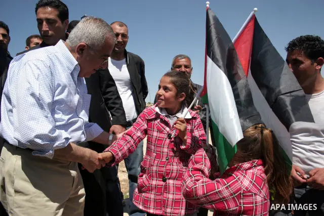 Palestinian prime minister Salam Fayyad during his visits in the southern town of Yatta, near Hebron in the occupied West Bank, on March 30, 2011, as hundreds of people across Israel and Palestinian territories were hold...