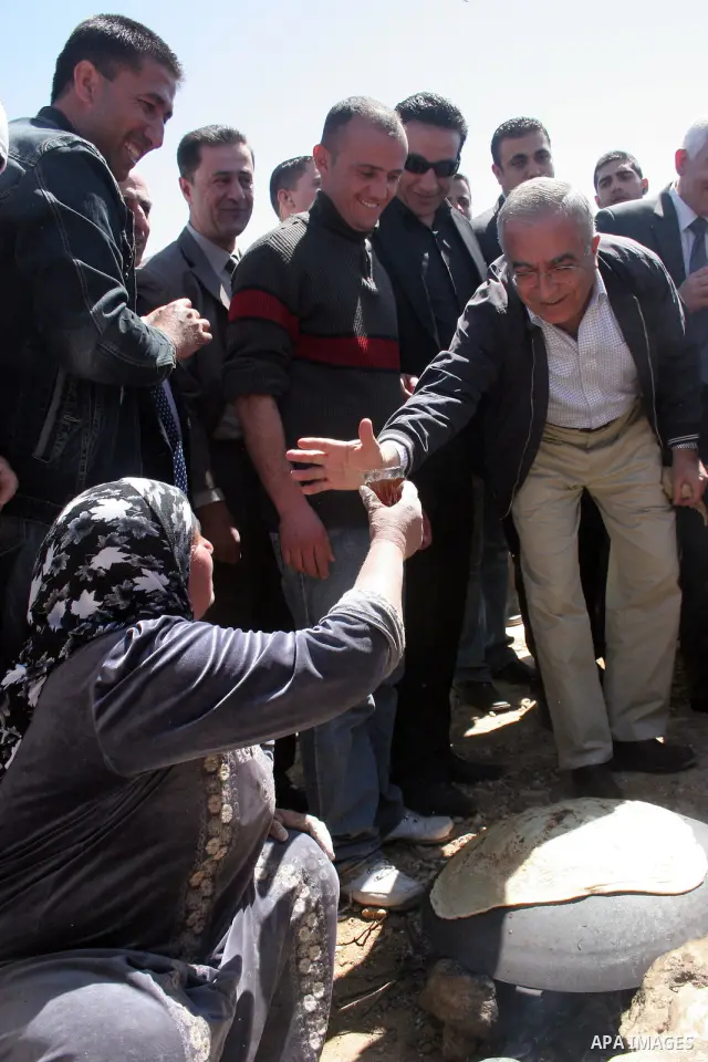 Palestinian prime minister Salam Fayyad during his visits in the southern town of Yatta, near Hebron in the occupied West Bank, on March 30, 2011, as hundreds of people across Israel and Palestinian territories were hold...