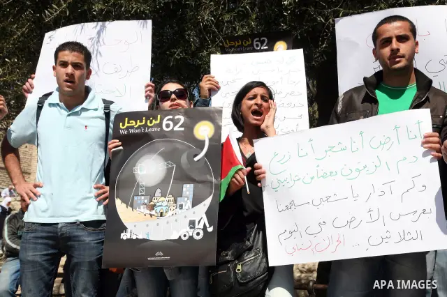 Palestinians take part in a demonstration at the Damascus Gate in East Jerusalem on Mar 30,2011, as hundreds of people across Israel and Palestinian territories were holding a series of rallies marking "Land Day," recall...