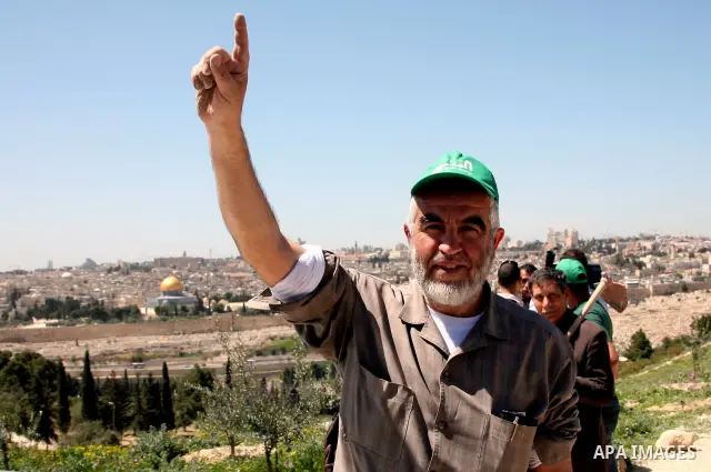 Sheikh Raed Salah and other Palestinians plant olive trees at the Mount of Olives, in East Jerusalem to mark the Land Day on March 30,2011, as hundreds of people across Israel and Palestinian territories were holding a s...