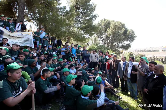 Sheikh Raed Salah and other Palestinians plant olive trees at the Mount of Olives, in East Jerusalem to mark the Land Day on March 30,2011, as hundreds of people across Israel and Palestinian territories were holding a s...