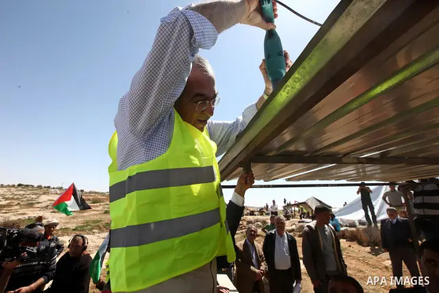 Palestinian prime minister Salam Fayyad visits the southern town of Yatta, near Hebron in the occupied West Bank, on March 30, 2011, as hundreds of people across Israel and Palestinian territories were holding a series o...