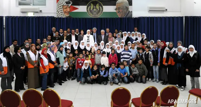 Palestinian President Mahmoud Abbas (Abu Mazen) meets with students of the full contact of the Red Crescent, west bank city of Ramallah March, 31,2011. photo by thaer ganaim