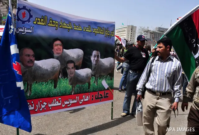 Egyptian protesters participate in a demonstration at the Tahrir square in Cairo, Egypt, Friday, April 1,2011, to call for Egypt's military government to harshly punish members of ex-President Hosni Mubarak's former admi...