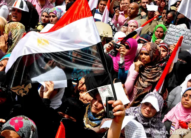 Egyptian protesters participate in a demonstration at the Tahrir square in Cairo, Egypt, Friday, April 1,2011, to call for Egypt's military government to harshly punish members of ex-President Hosni Mubarak's former admi...