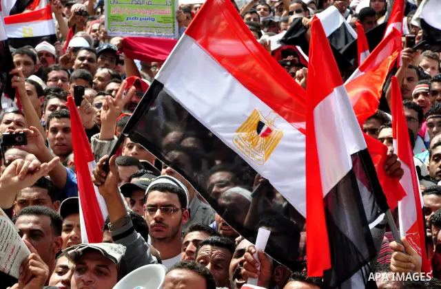 Egyptian protesters participate in a demonstration at the Tahrir square in Cairo, Egypt, Friday, April 1,2011, to call for Egypt's military government to harshly punish members of ex-President Hosni Mubarak's former admi...
