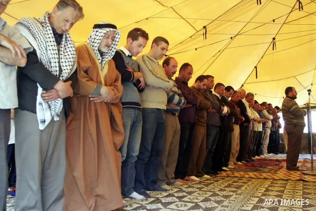 Palestinians attend Friday prayers at the protest tent in the Silwan neighborhood in East Jerusalem on 01 April 2011 as Palestinian protesters gather for a demonstration. A few stones were thrown and a few rounds of tear...