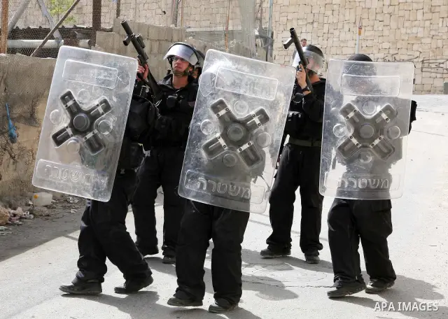 Israeli riot police who deploy in the Silwan neighborhood in East Jerusalem after Friday prayers on 01 April 2011 as Palestinian protesters gather for a demonstration. A few stones were thrown and a few rounds of tear ga...