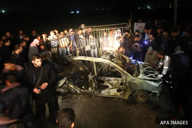 Palestinian Hamas officers inspect a vehicle following an Israeli airstrike that killed three of Hamas militants near Deir Al Balah, central Gaza Strip, early Saturday, April 2, 2011. Israeli aircraft killed the militant...