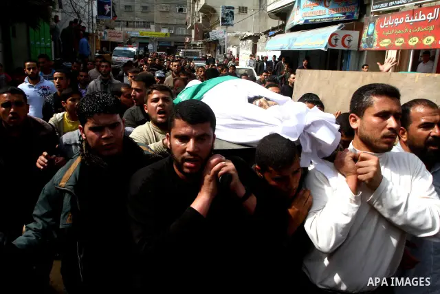 Palestinians carry the bodies of Hamas militants Ismail Lubbad and Abdallah Lubbad, two brothers killed earlier in an Israeli airstrike, during their funeral in Shati refugee camp in Gaza City, Saturday, April 2, 2011. I...