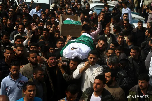 Palestinians carry the bodies of Hamas militants Ismail Lubbad and Abdallah Lubbad, two brothers killed earlier in an Israeli airstrike, during their funeral in Shati refugee camp in Gaza City, Saturday, April 2, 2011. I...