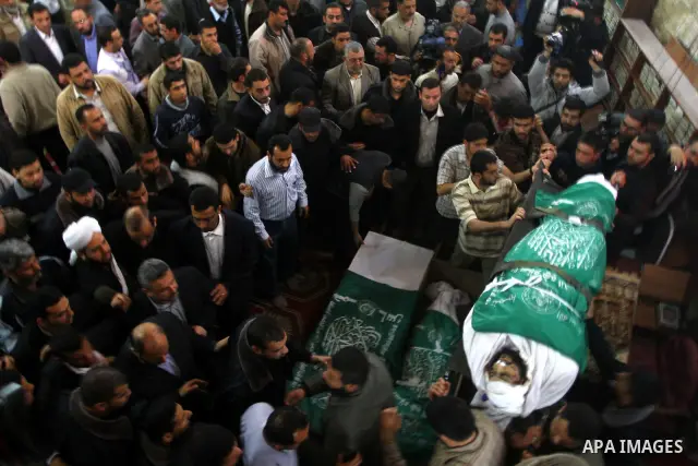 Palestinians carry the bodies of Hamas militants in Al-Omari Mosque during their funeral in Gaza City April 2, 2011. Israeli aircraft killed three Palestinian gunmen in the southern Gaza Strip early on Saturday, medical...