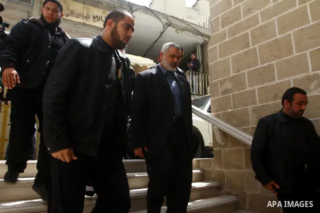 Palestinian Prime Minister of Hamas Ismail Haniyeh walks with bodyguards headed to Al- Omari Mosque in Gaza City to take a part in three of hamas members funeral. Israeli aircraft killed three Palestinian militants early...