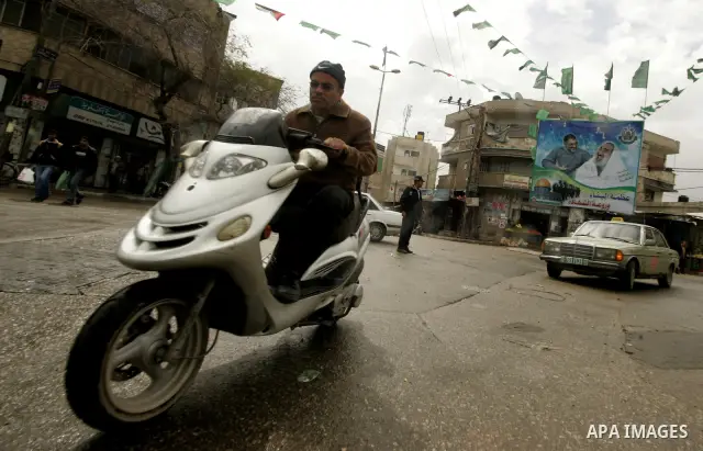 A Palestinian man rides his motorcycle in Rafah in the southern Gaza Strip, on April 4, 2011, a day after Israel demanded that the United Nations bin a report critical of its deadly 2008-2009 offensive on Gaza after the...
