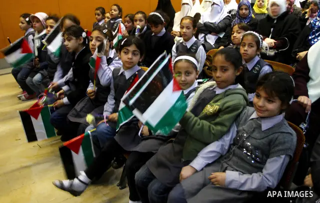 Palestinians children attend a celebration to mark the Orphan Day at al-Shawwa theatre in Gaza city on April 4,2011. Photo by Ashraf Amra