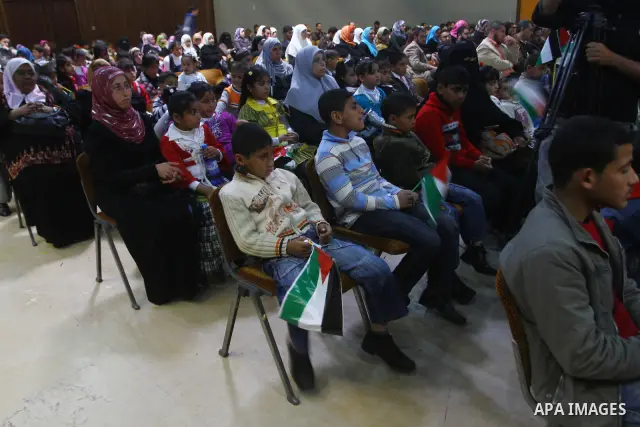 Palestinians children attend a celebration to mark the Orphan Day at al-Shawwa theatre in Gaza city on April 4,2011. Photo by Ashraf Amra