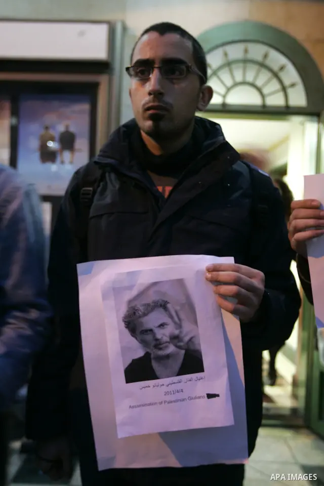 Palestinians hold posters depicting Israeli actor and director, Juliano Mer Khamis, during a protest in the West Bank city of Ramallah April 4, 2011. A masked gunman shot dead on Monday the well-known Israeli actor and d...