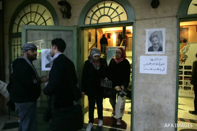 Palestinians hold posters depicting Israeli actor and director, Juliano Mer Khamis, during a protest in the West Bank city of Ramallah April 4, 2011. A masked gunman shot dead on Monday the well-known Israeli actor and d...