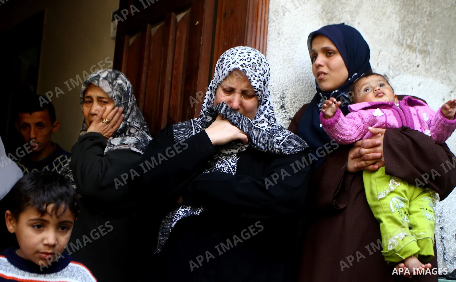 Relatives of Palestinian Mohammed Shalha react during his funeral in Jebaliya refugee camp, northern Gaza Strip, Tuesday, April 5, 2011. Palestinian authorities said that Shalha, 21, was killed by Israeli fire along Gaza...