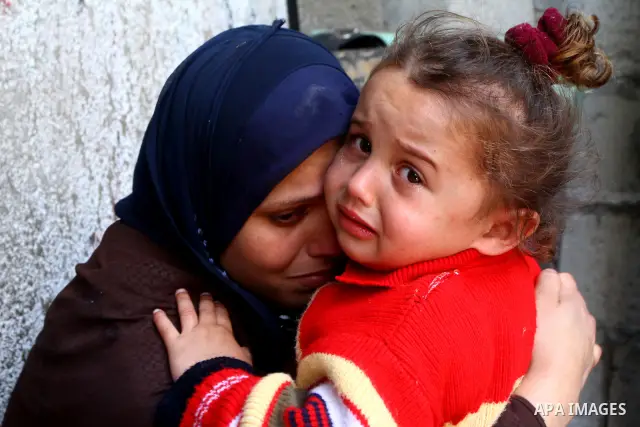 Relatives of Palestinian Mohammed Shalha react during his funeral in Jebaliya refugee camp, northern Gaza Strip, Tuesday, April 5, 2011. Palestinian authorities said that Shalha, 21, was killed by Israeli fire along Gaza...