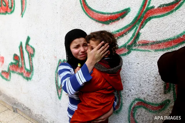 Relatives of Palestinian Mohammed Shalha react during his funeral in Jebaliya refugee camp, northern Gaza Strip, Tuesday, April 5, 2011. Palestinian authorities said that Shalha, 21, was killed by Israeli fire along Gaza...