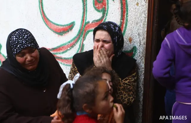 Relatives of Palestinian Mohammed Shalha react during his funeral in Jebaliya refugee camp, northern Gaza Strip, Tuesday, April 5, 2011. Palestinian authorities said that Shalha, 21, was killed by Israeli fire along Gaza...