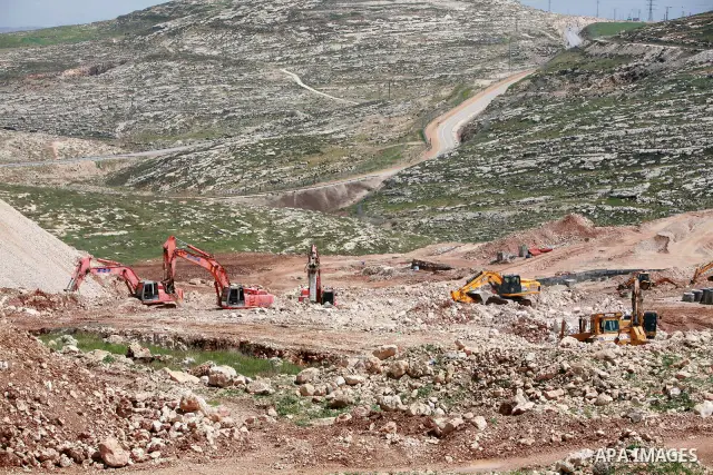 Israeli bulldozers work in the jewish settlement of Pisgat Zeev in East Jerusalem, Tuesday, April 5, 2011. A group of prominent Israelis is presenting an informal new peace proposal, hoping to breathe life into deadlocke...