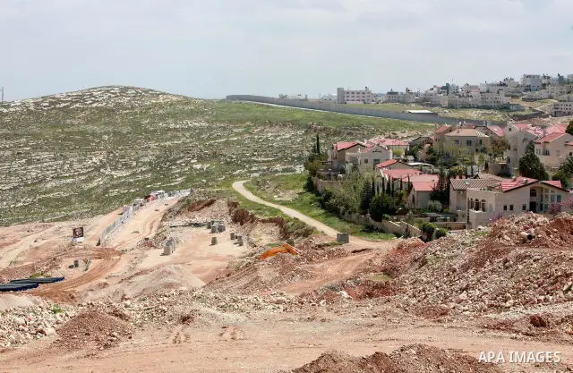 Israeli bulldozers work in the jewish settlement of Pisgat Zeev in East Jerusalem, Tuesday, April 5, 2011. A group of prominent Israelis is presenting an informal new peace proposal, hoping to breathe life into deadlocke...