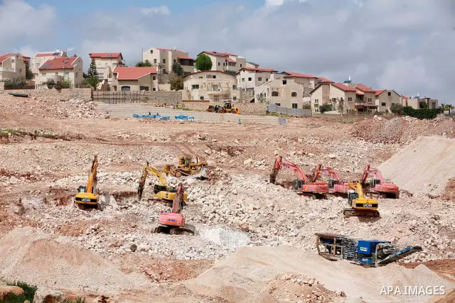 Israeli bulldozers work in the jewish settlement of Pisgat Zeev in East Jerusalem, Tuesday, April 5, 2011. A group of prominent Israelis is presenting an informal new peace proposal, hoping to breathe life into deadlocke...