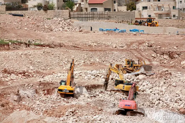 Israeli bulldozers work in the jewish settlement of Pisgat Zeev in East Jerusalem, Tuesday, April 5, 2011. A group of prominent Israelis is presenting an informal new peace proposal, hoping to breathe life into deadlocke...