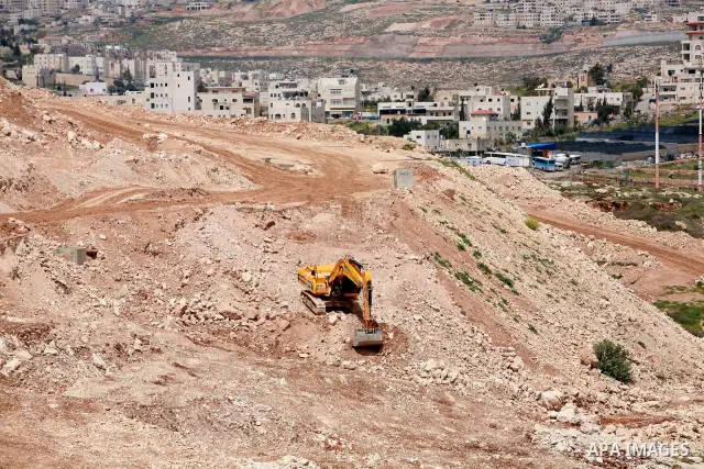 Israeli bulldozers work in the jewish settlement of Pisgat Zeev in East Jerusalem, Tuesday, April 5, 2011. A group of prominent Israelis is presenting an informal new peace proposal, hoping to breathe life into deadlocke...