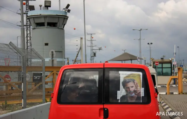 Palestinian Students of Jenin's Freedom Theater weep while waiting for the body of Arab-Israeli actor and director Juliano Mer-Khamis during his funeral at al Jalama Israeli checkpoint between Hayfa City and the West Ban...