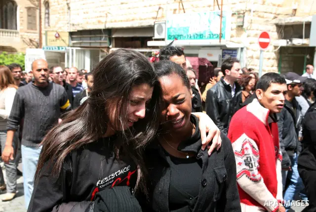 People mourn the Arab-Israeli actor and director Juliano Mer Khamis during a funeral procession near al-Midan theater in the northern Israeli city of Haifa April 6, 2011. Mer-Khamis was gunned down Monday in the West Ban...