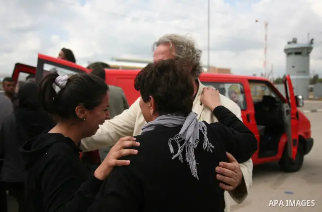 People mourn the Arab-Israeli actor and director Juliano Mer Khamis during a funeral procession near al-Midan theater in the northern Israeli city of Haifa April 6, 2011. Mer-Khamis was gunned down Monday in the West Ban...
