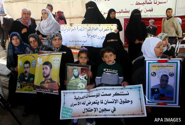 Palestinians hold pictures of jailed relatives during a protest in Gaza city calling for their release from Israeli prisons on April 7, 2011. Photo by Ashraf Amra
