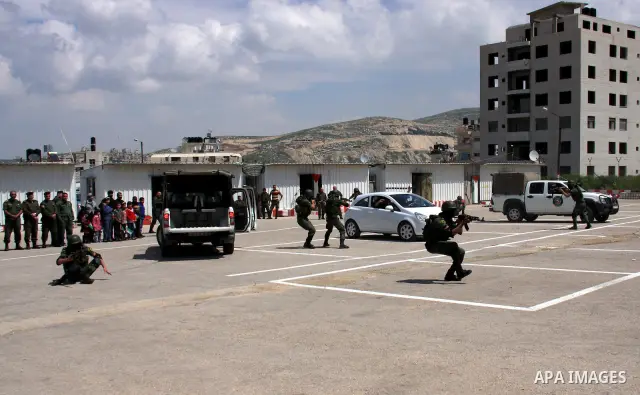 Palestinian police officers loyal to Palestinian President Mahmoud Abbas take part in a training session in the West Bank city of Nablus, Thursday on April 7, 2011. Photo by Wagdi Eshtayah