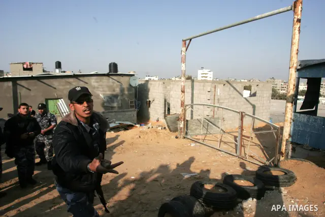 Palestinian security forces inspect bombed Hamas police training camp in Beit Lahia on April 7, 2011 after Israeli troops shelled two separate areas in Gaza, killing one person and wounded at least 10. Photo by Mohammed...