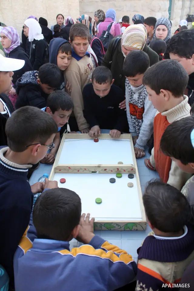 Palestinian children take part in playing festival ( All Together with Children) at Child Happiness Center in the West Bank city of Hebron,on April 07, 2011.Photo by Najeh Hashlamoun